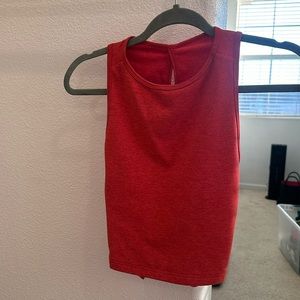 Ptula women’s workout top size S. Color is hot sauce, it’s a red/orange color.
